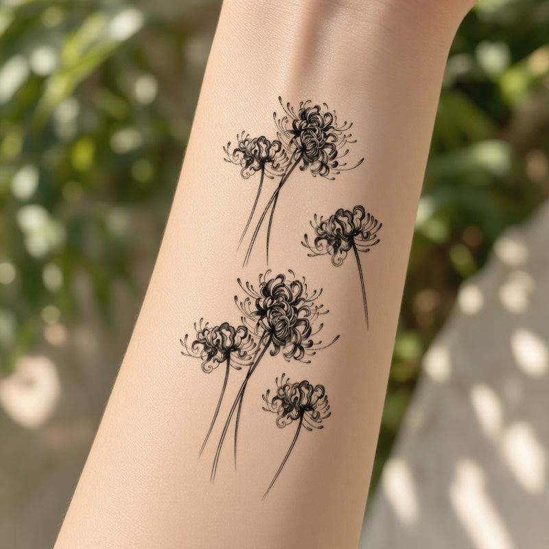 Black and grey spider lilies temporary tattoo worn on the forearm
