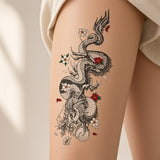 Dragon and flowers temporary tattoo worn on the thigh